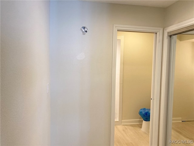 hallway with light wood-type flooring