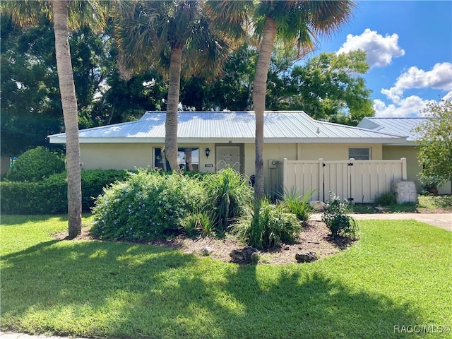 view of side of property featuring a yard