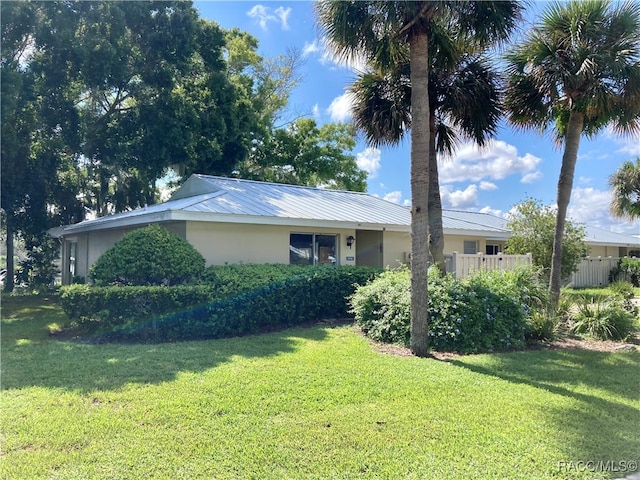 view of property exterior with a yard