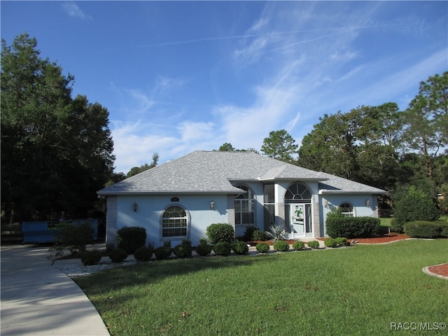 view of front of property with a front lawn