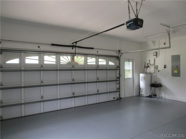 garage featuring electric panel, a garage door opener, and water heater