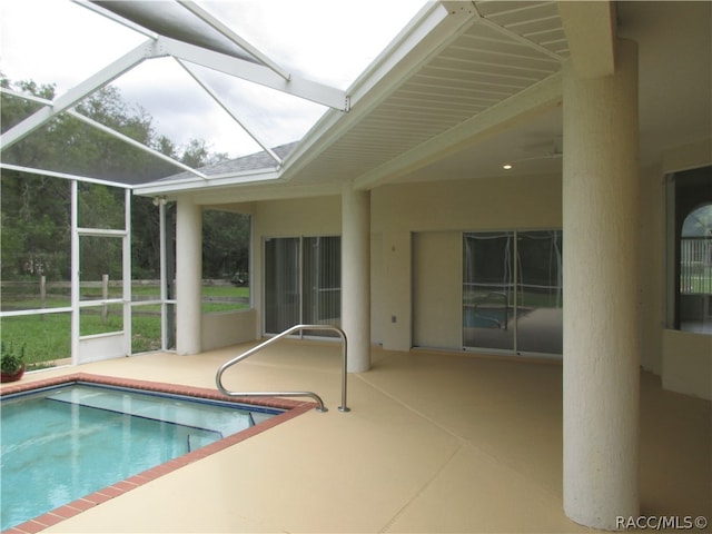 view of pool with a lanai and a patio area