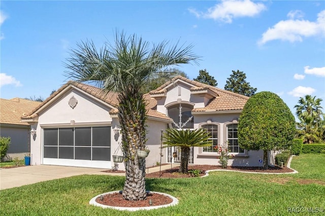 mediterranean / spanish-style house with a front yard, a tiled roof, an attached garage, and stucco siding