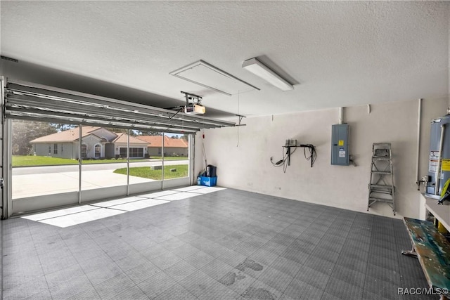 garage featuring a garage door opener, a residential view, electric panel, and water heater