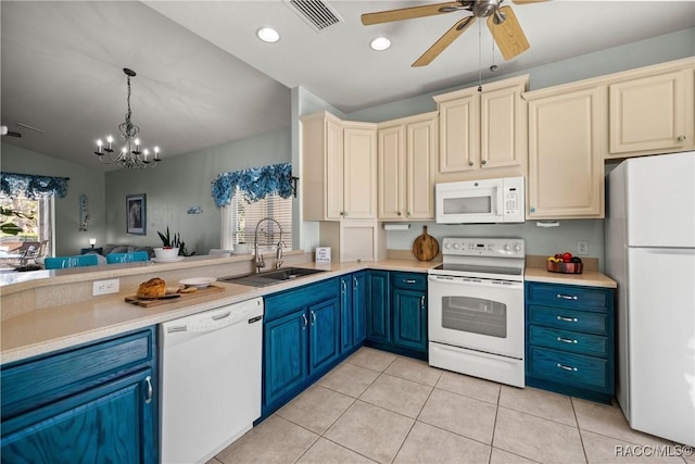 kitchen with light countertops, white appliances, a sink, and visible vents