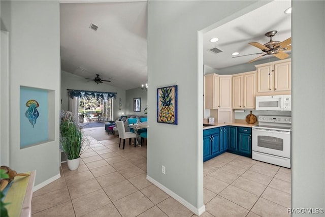 kitchen with light tile patterned floors, white appliances, visible vents, open floor plan, and light countertops