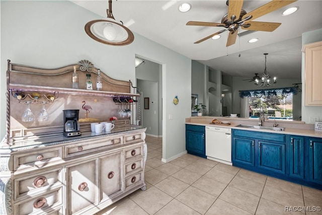 kitchen featuring lofted ceiling, light countertops, dishwasher, and a sink