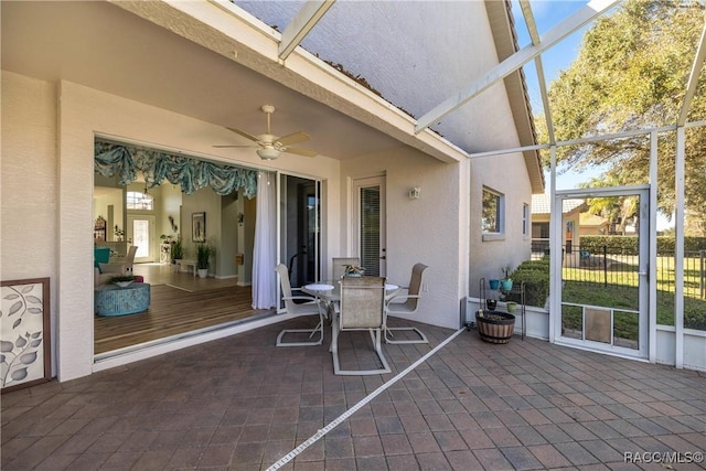 exterior space featuring ceiling fan