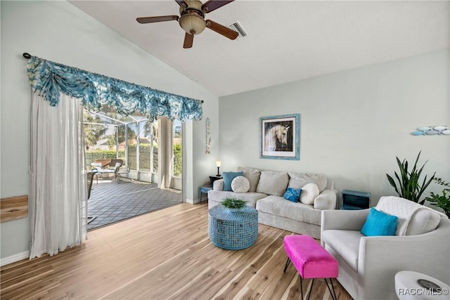 living room featuring baseboards, visible vents, a ceiling fan, wood finished floors, and vaulted ceiling