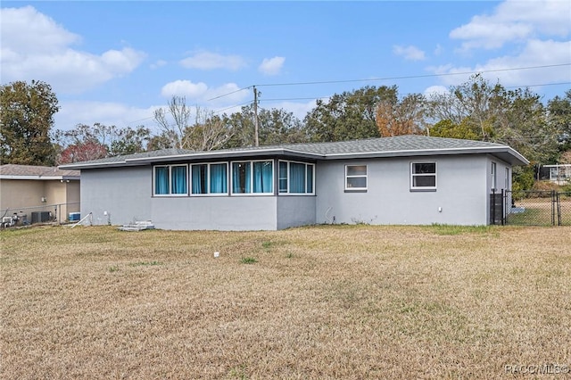 exterior space with a yard and central AC unit