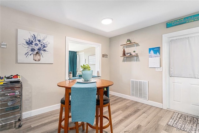 dining room with light hardwood / wood-style floors