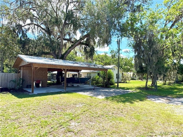 view of yard with a carport