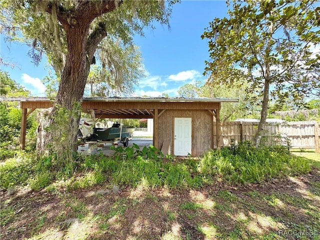 view of outdoor structure with fence