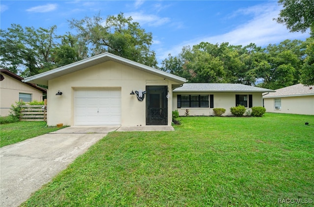 single story home featuring a garage and a front yard