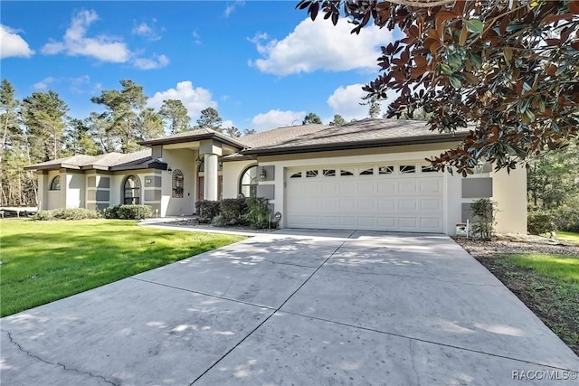 view of front facade with a front yard and a garage