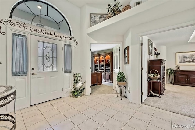 entryway with light carpet