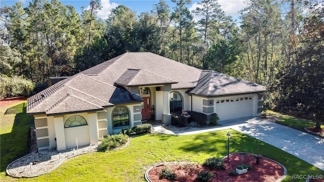 view of front of home with a garage and a front yard