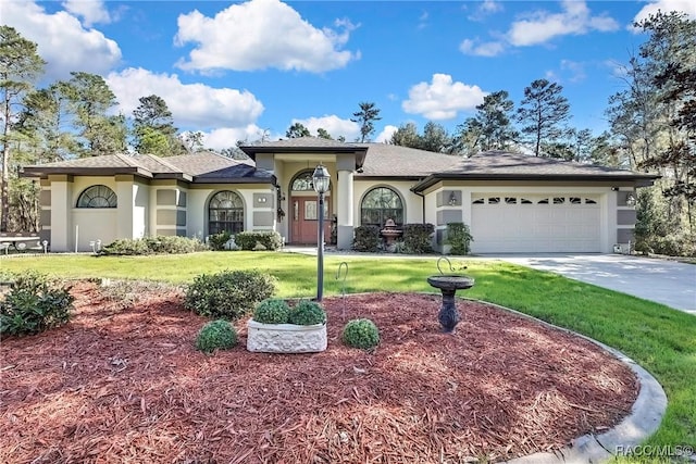 view of front of home featuring a garage and a front yard