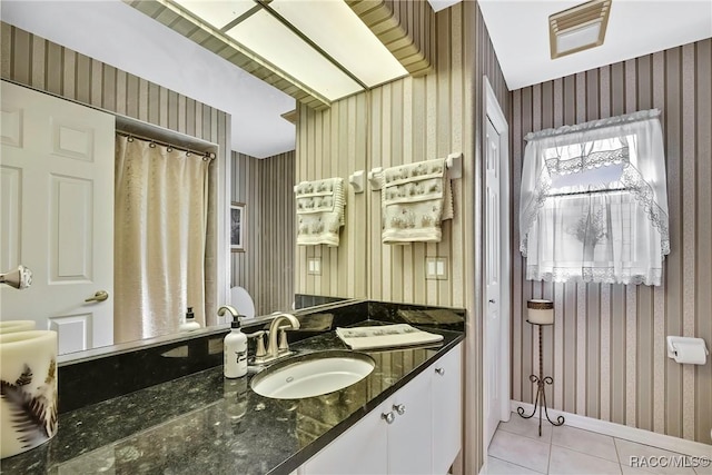 bathroom with tile patterned floors and vanity