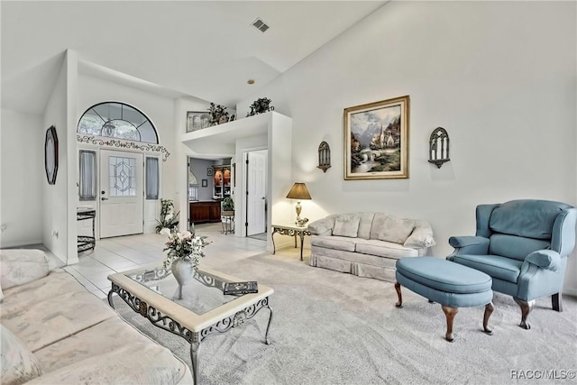 living room featuring high vaulted ceiling