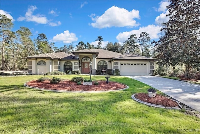 view of front facade with a front lawn and a garage