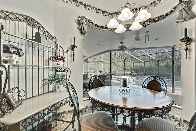 dining space featuring lofted ceiling and an inviting chandelier