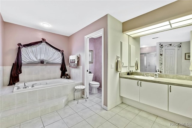 full bathroom featuring tile patterned floors, vanity, separate shower and tub, and toilet