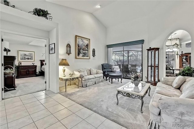 tiled living room featuring vaulted ceiling