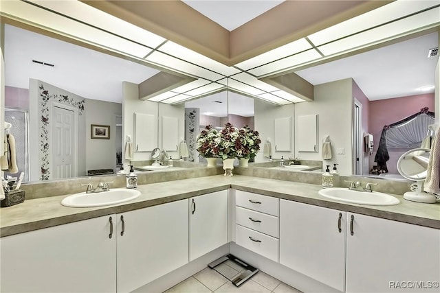 bathroom featuring tile patterned flooring and vanity