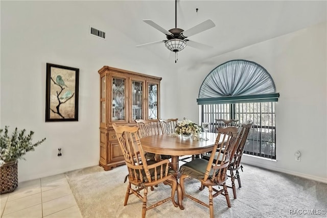 dining area featuring ceiling fan and light tile patterned flooring