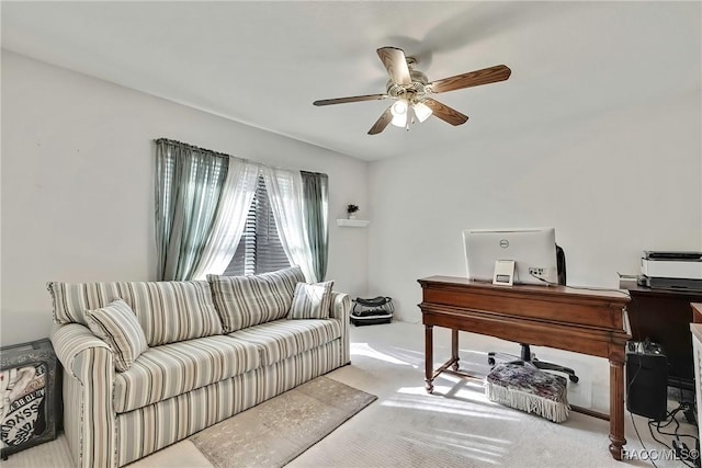 office area with ceiling fan and light colored carpet