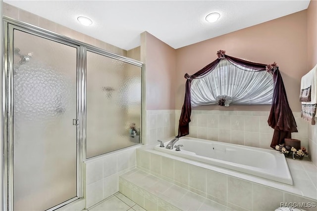 bathroom featuring tile patterned floors and plus walk in shower