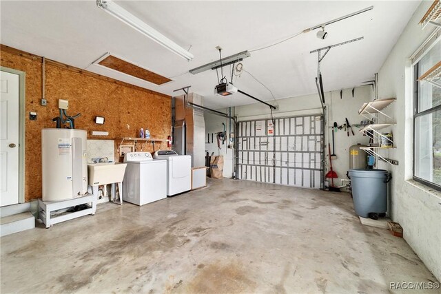 220 E Liberty St, Hernando, FL 34442 - garage with water heater, a garage door opener, and separate washer and dryer