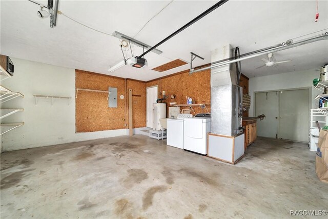 220 E Liberty St, Hernando, FL 34442 - garage with washer and clothes dryer, a garage door opener, water heater, ceiling fan, and electric panel