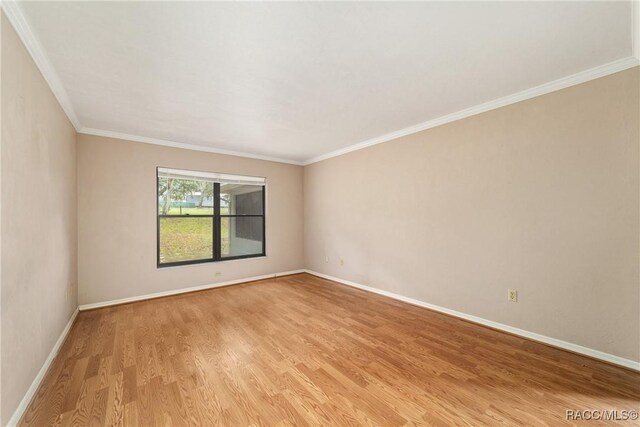 220 E Liberty St, Hernando, FL 34442 - unfurnished room with light wood-style flooring and ornamental molding