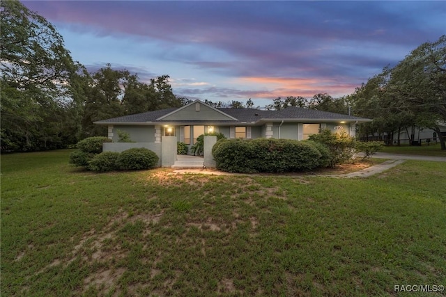 220 E Liberty St, Hernando, FL 34442 - ranch-style house with a front lawn and stucco siding