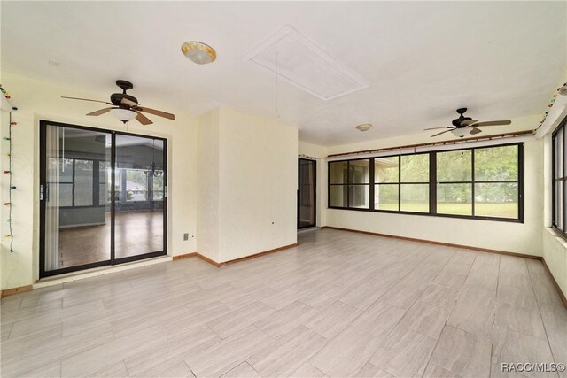 220 E Liberty St, Hernando, FL 34442 - unfurnished room featuring attic access and a ceiling fan
