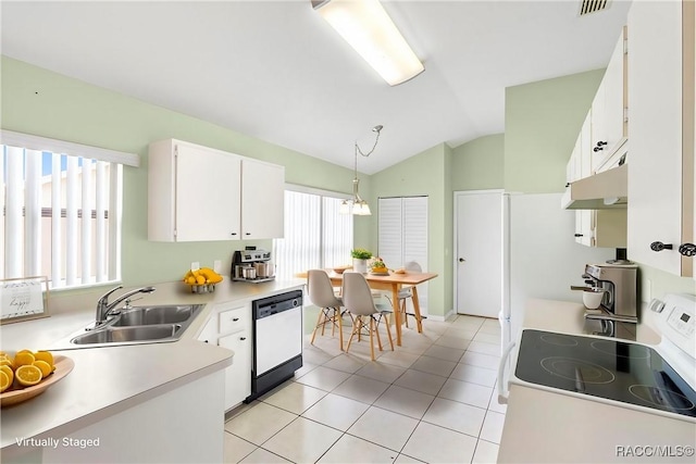 kitchen featuring white appliances, a sink, white cabinets, light countertops, and pendant lighting