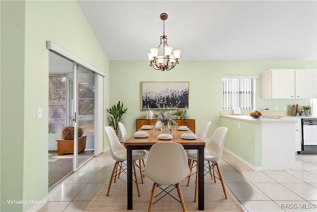 dining area featuring light tile patterned floors, baseboards, vaulted ceiling, and a notable chandelier