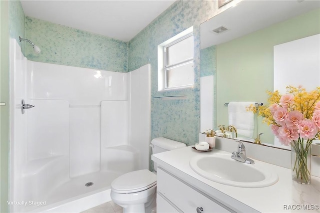 full bathroom featuring a stall shower, visible vents, toilet, and wallpapered walls