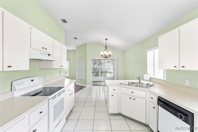 kitchen with white appliances, a sink, white cabinetry, light countertops, and pendant lighting