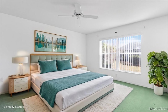 bedroom featuring a ceiling fan, dark colored carpet, and baseboards