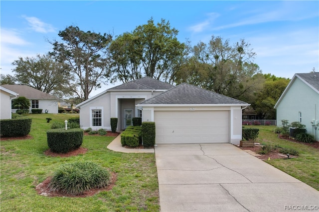 view of front of home with a garage, concrete driveway, roof with shingles, stucco siding, and a front lawn