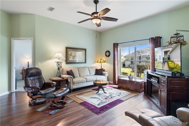 living room featuring ceiling fan and light wood-type flooring