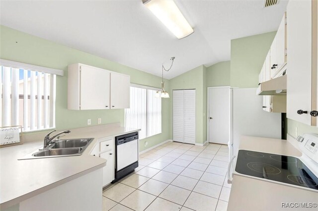 kitchen featuring a breakfast bar area, white range with electric cooktop, light countertops, white cabinetry, and a sink