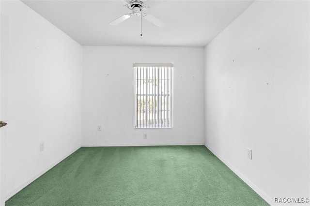 unfurnished room featuring carpet floors and a ceiling fan