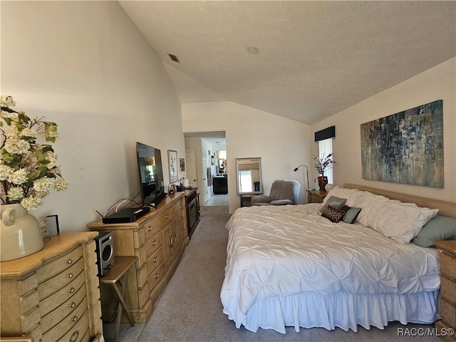 carpeted bedroom with vaulted ceiling