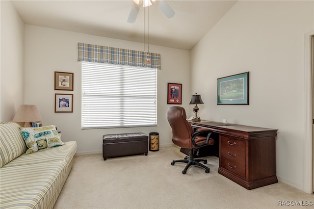 office featuring ceiling fan, light colored carpet, and vaulted ceiling