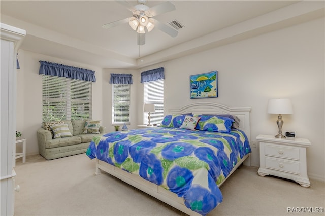 carpeted bedroom with ceiling fan