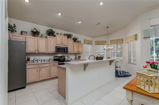 kitchen featuring a center island with sink, refrigerator, light brown cabinets, and black range with electric cooktop